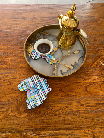 coasters in the shape of Africa with an ethnic pattern