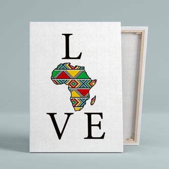 A stretched Canvas Print with L O V E printed on it. The O is represented by a fill map of Africa with a superimposed geometric pattern. Colours: green, red, Yellow, Blue. 