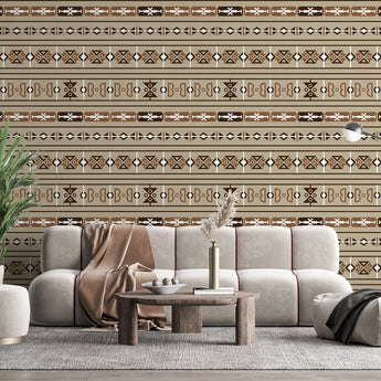Sepedi inspired wallpaper with various geometric shapes. Background of the wallpaper is beige, with  shapes in colours dark brown, light brown, white on a wall in a  living room setting.