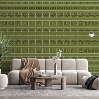 Sepedi inspired wallpaper with various geometric shapes. Background of the wallpaper is olive green, with  shapes in dark green colour on a wall in a  living room setting.
