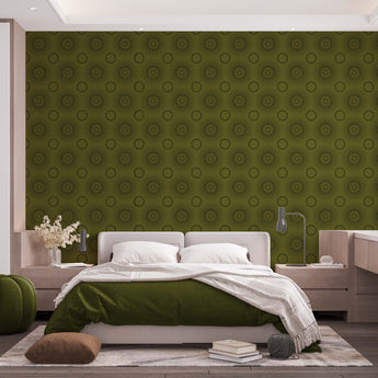 A bedroom with complete bedroom furniture and bedding. On the one wall is a wallpaper with a Olive green background and dark green circles.
