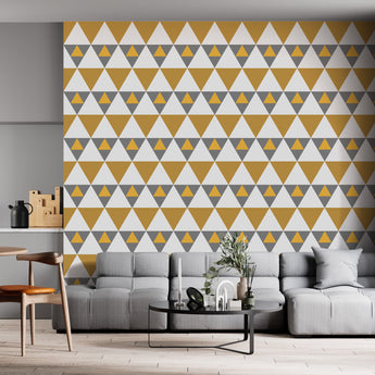Xhosa inspired wallpaper geometric triangular mustard, grey, white on a wall in a  living room setting
